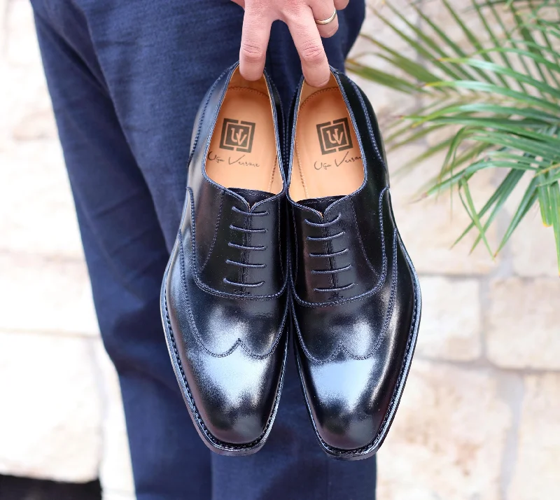 Men's Oxford shoes with a smooth leather upper and a leather soleBurnished Calfskin "Wick" Lace-Up Wingtip Oxford Black