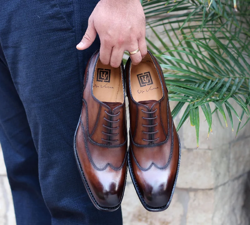 Men's Oxford shoes with a wingtip design and leather soleBurnished Calfskin "Wick" Lace-Up Wingtip Oxford Walnut