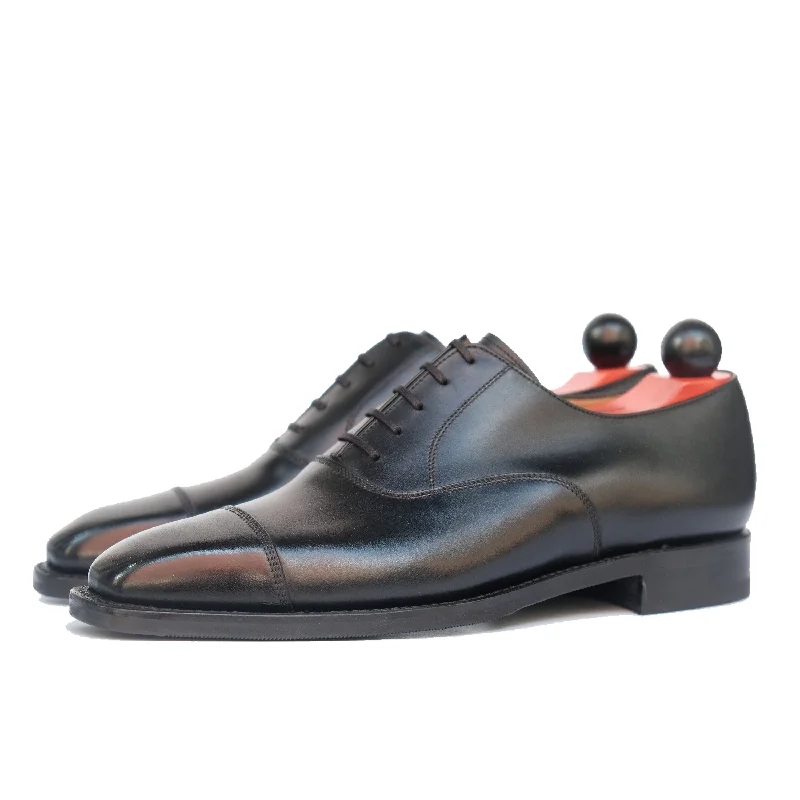 Men's Oxford shoes with a buckle closure and a pointed toePuget - Black Calf