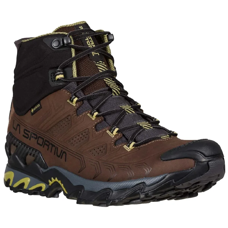 Men's hiking boots with a tough outer shellLa Sportiva Ultra Raptor II Mid Leather Wide GTX Mens Hiking Boot - Chocolate/Cedar Men's hiking boots with a tough outer shellLa Sportiva Ultra Raptor II Mid Leather Wide GTX Mens Hiking Boot - Chocolate/Cedar